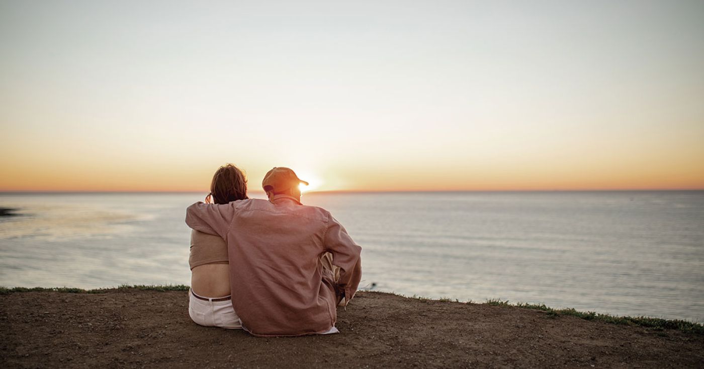 Couple watching sunset in Ibiza